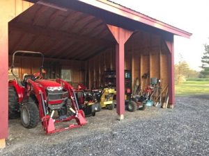 Mowers in the tractor shed at New Fadum Farm